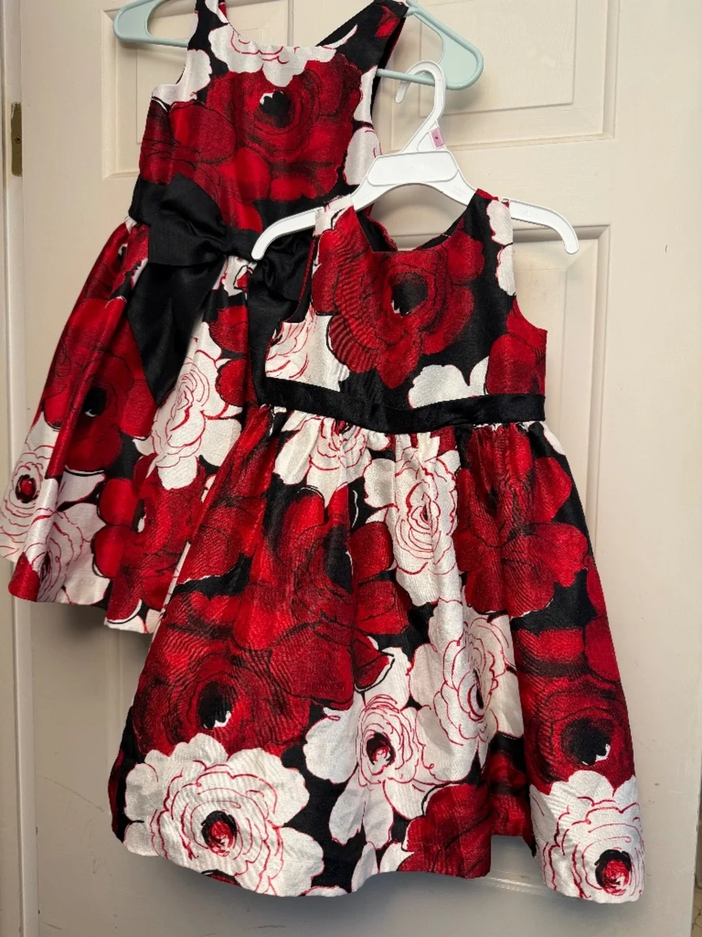 2 matching  dresses. size 5 and size 3t.